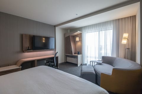 Desk, laptop workspace, blackout drapes, iron/ironing board