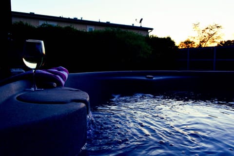 view of sunset while soaking in hot tub