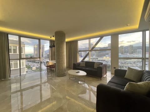 Deluxe Apartment, 2 Bedrooms | Living area | Fireplace, heated floors