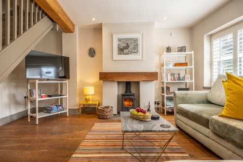 Sherbet Cottage, South Creake: A cosy sitting room warmed by a wood burning stove