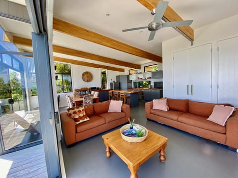Cosy lounge with smart TV and deck access.