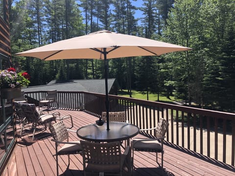 Main-level deck - wrap-around with 5-spot dining and 4 lounge recliners, grill