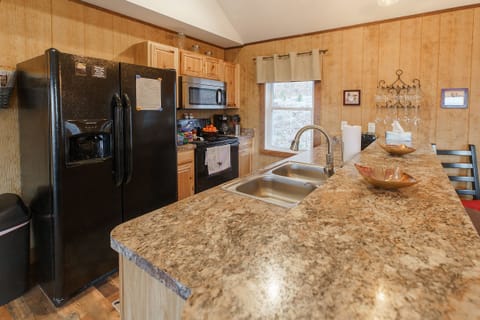 Large Fridge and bar with barstools