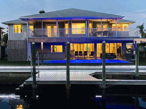 Back of the house - heated pool - dock with boat lift / kayaks