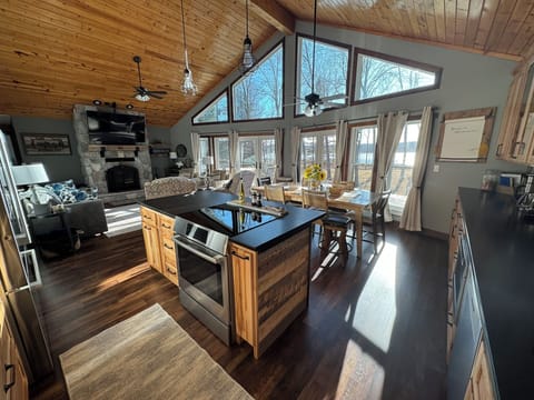 Great room includes kitchen and living room with 22' vaulted ceiling.