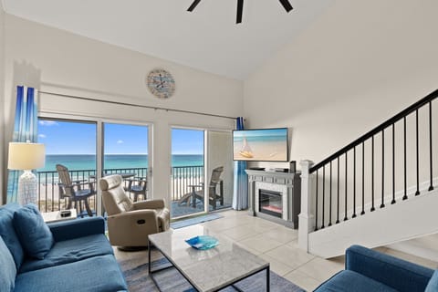 Unwind in your oceanfront living space where panoramic views greet you through expansive glass doors. Relax on plush sofas or step onto the private balcony to feel the coastal breeze.