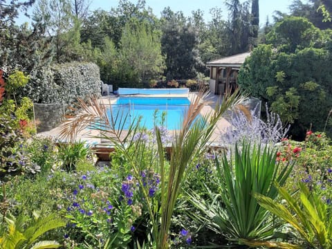 Seasonal outdoor pool, open 9:00 AM to 10:00 PM, pool umbrellas