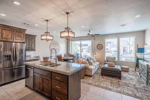 Kitchen View - The kitchen is fully stocked with all the dishes, cookware, baking pans, and cutlery you will need for meal preparations and includes stainless steel appliances and granite counter tops.