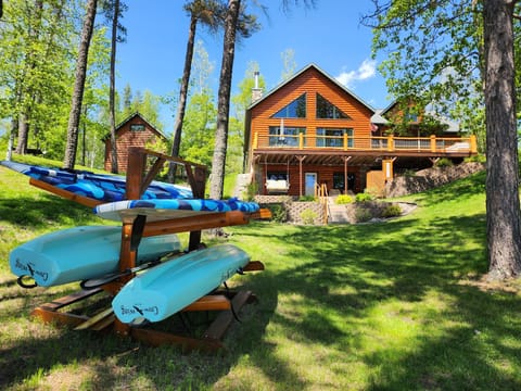 2 stand up paddle boards, 2 kayaks, floating water mat, row boat and paddle boat
