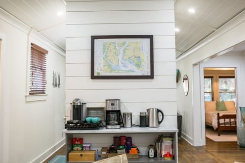 Coffee bar set up with Nespresso machine, kettle, drip, frother, & French press