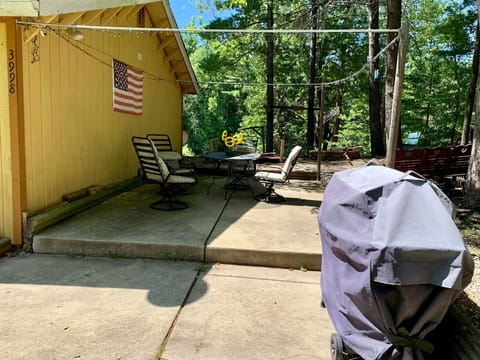 Outdoor patio, grill, and bonfire.