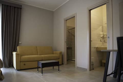 Family Room | Minibar, desk, laptop workspace, soundproofing