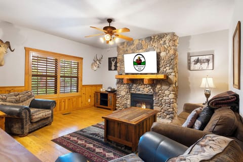 Living Room with Cable TV, Seasonal Gas Fireplace, and Air Mattress