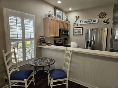 Cozy dining space on 1st floor for 2! Full dining room + kitchen upstairs too!