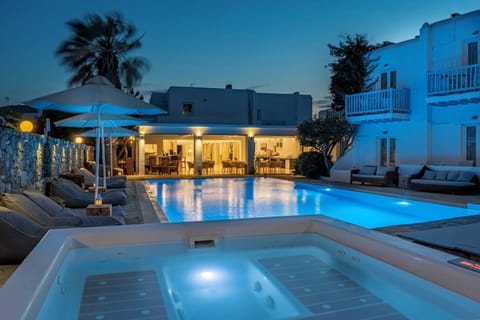 Seasonal outdoor pool, open 10:00 AM to 8:00 PM, pool umbrellas