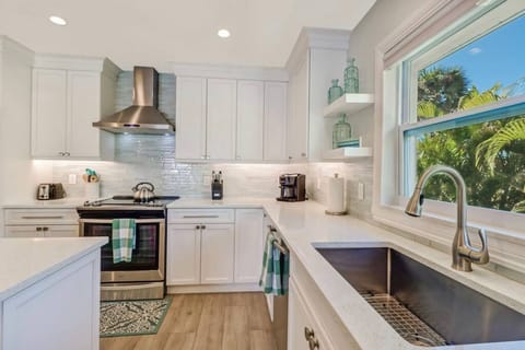 Kitchen with extra deep trough sink and Keurig Duo coffee pot.