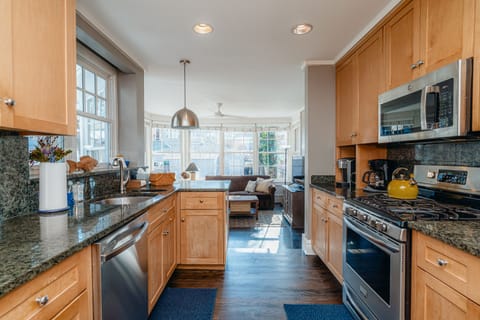 New chefs kitchen with stainless steel appliances and granite countertops