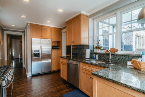 New chefs kitchen with stainless steel appliances and granite countertops
