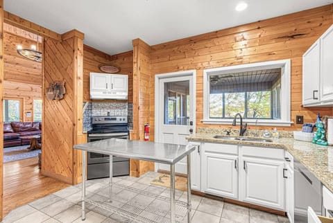 Fully stocked kitchen opens up to the living/dining area and also to the fabulous screened in porch.