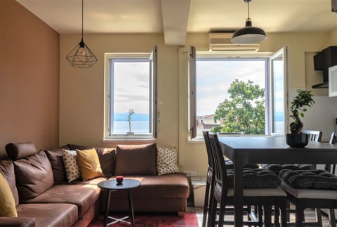 Apartment, 1 Bedroom, Smoking, Garden View | Living area | TV