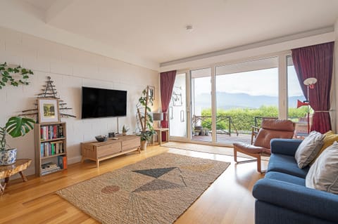 Upon entry, the home leads to a spacious living area that opens towards the deck. Relax in air-conditioned comfort as you enjoy a spot of TV.