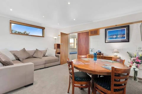 The open plan living and dining area is a quaint, and quiet little space to relax and unwind while watching TV.