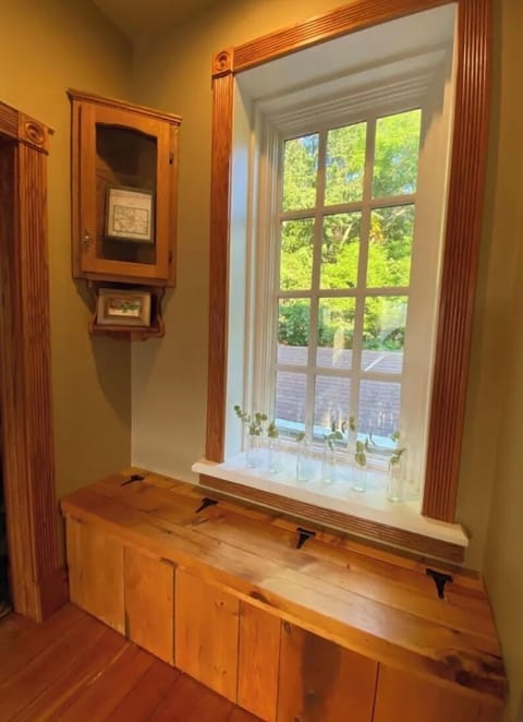 A cozy window seat that looks out onto the back patio and yard…