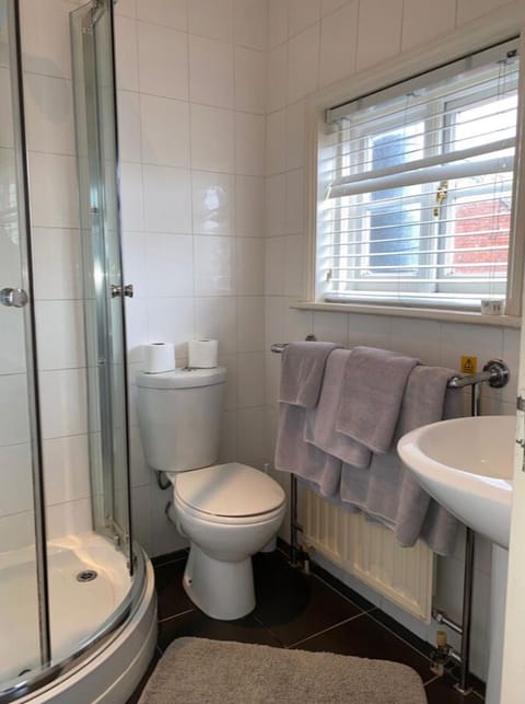 Family Room, Multiple Beds | Bathroom | Shower, free toiletries, hair dryer, towels