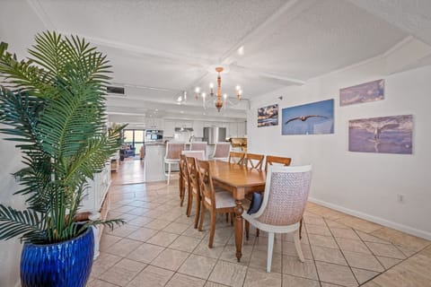 Coastal dining room table with seating for 8 guests and 3 bonus barstools at the kitchen counter