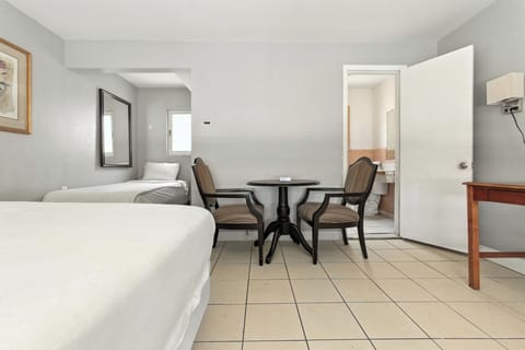 Basic Double or Twin Room, Multiple Beds | Laptop workspace, iron/ironing board, free WiFi, bed sheets