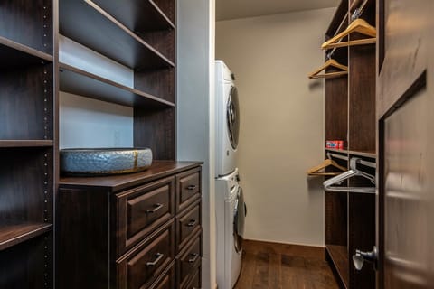 Walk in closet with private washer & dryer in Primary Suite