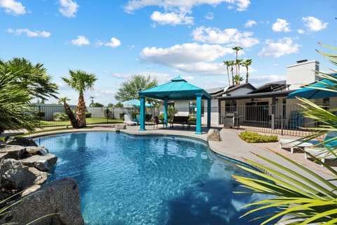 Outdoor oasis at the Turquiose House West including 2 large putting greens, pool