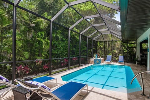 The lush tropical landscaping makes this an island oasis.