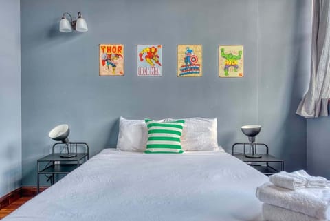 Bedroom 1: Vibrant bedroom with a comfy queen-size bed to keep you relaxed during your stay