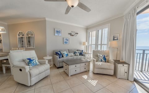 Spacious living area with new soda sleeper and coastal decor (September 2023)