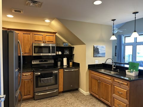 Enter into well-stocked kitchen