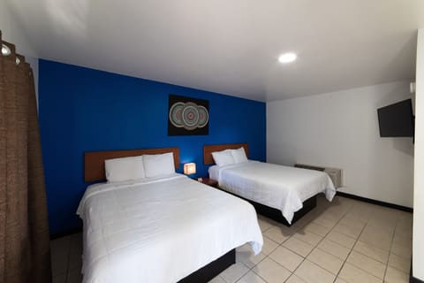Standard Quadruple Room, 2 Queen Beds, Non Smoking, Refrigerator & Microwave | Desk, iron/ironing board, free WiFi, bed sheets