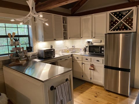 Newly updated kitchen with stainless steel counter tops