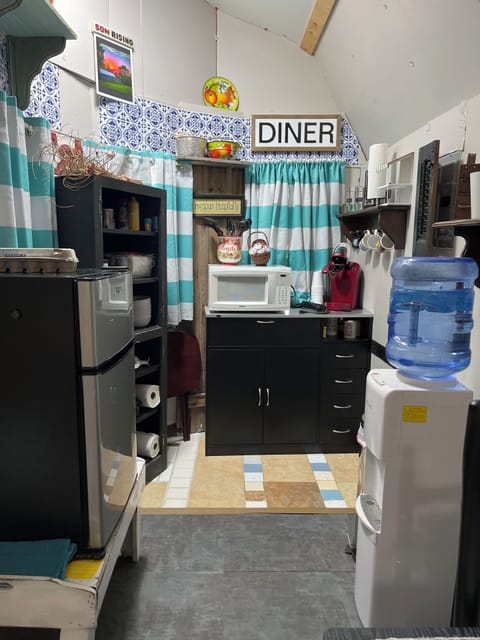 In the kitchenette, you have mini fridge microwave, Keurig, coffee, pot