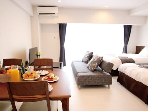 Standard Twin Room | Living area | 30-inch flat-screen TV with digital channels, TV