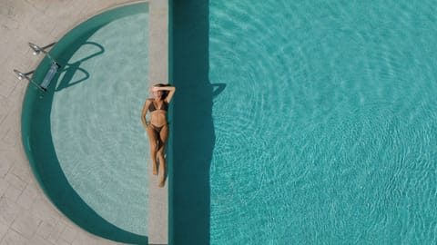 Dive into our 42m² pool, framed by lush gardens and Cretan serenity.