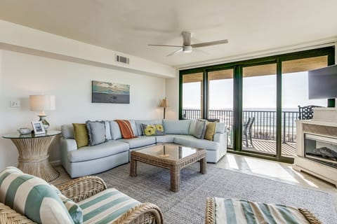 Open-concept living room with Gulf views and tile flooring at Wind Drift Orange Beach