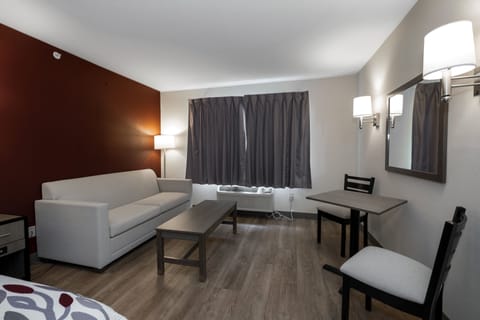 Desk, laptop workspace, blackout drapes, iron/ironing board