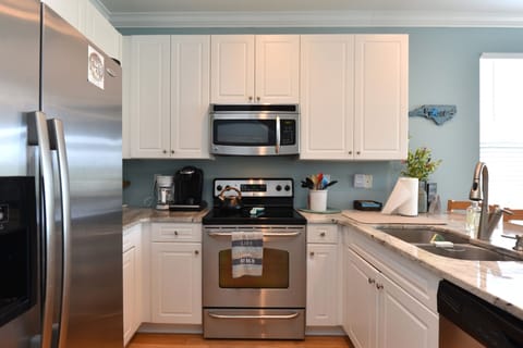 Fully stocked kitchen with stainless steel appliances