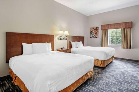 Suite, 2 Queen Beds, Non Smoking | Desk, laptop workspace, blackout drapes, iron/ironing board