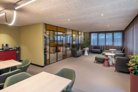 A cosy lounge area with chic furnishings and vibrant design, perfect for casual gatherings.