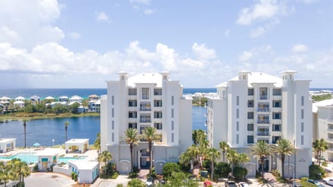 Modern beachfront resort buildings overlook pristine turquoise waters and tropical lagoons in this stunning Caribbean destination.