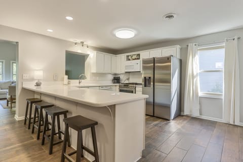 Fully appointed kitchen; bar seating for 4