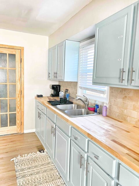 Open kitchen layout flows seamlessly into dining and living spaces.