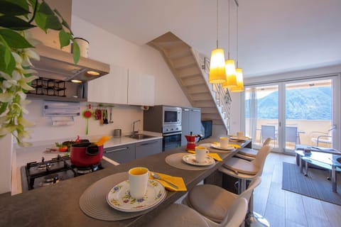 Family Apartment, Multiple Bedrooms, 2 Bathrooms, Mountainside (Como Lake Modern Apartment Ulivi) | Private kitchen | Full-size fridge, microwave, oven, stovetop